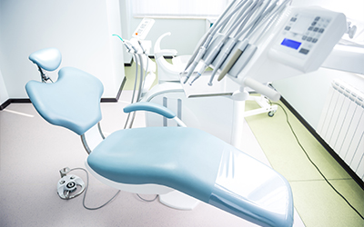 An image of a dental chair and equipment