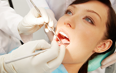 A woman having work done on her teeth