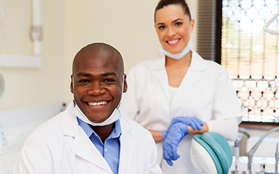 Male dentist smiling