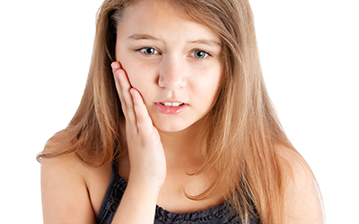 Young girl with dental pain