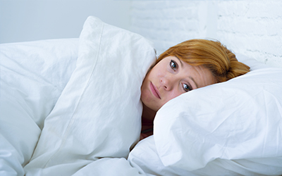 A woman laying in a bed