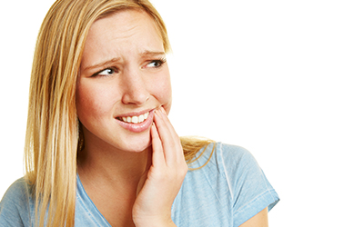 Young woman with toothache