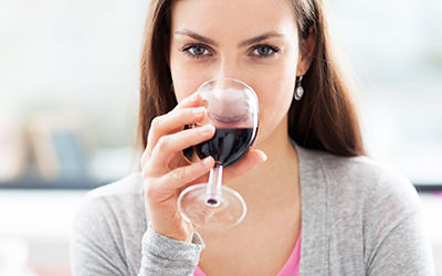 A woman drinking alcohol