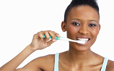 A woman brushing her teeth