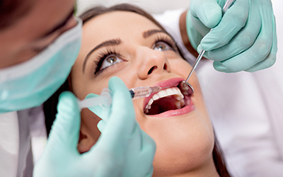 Dentist examining patient