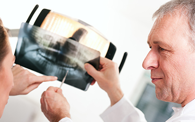 Dentist explaining x-ray to patient